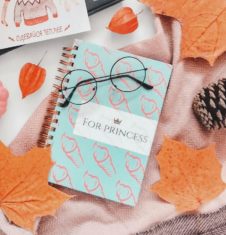 Autumn flat lay with notebook, laptop, and leaves